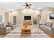 Bright living room with vaulted ceiling, ceiling fan, and stylish decor; perfect for entertaining at 18736 Bent Pine Dr, Hudson, FL 34667