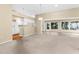 Open floor plan connects the kitchen and living area with outdoor access at 18736 Bent Pine Dr, Hudson, FL 34667