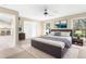 The main bedroom boasts ample natural light with access to an outdoor patio at 18736 Bent Pine Dr, Hudson, FL 34667