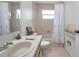 Neutral bathroom featuring a large vanity with a tub and shower combo at 2048 Ground Squirrel Dr, New Port Richey, FL 34655