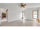 Spacious bedroom featuring tile floors, ceiling fan, and bright natural lighting at 2048 Ground Squirrel Dr, New Port Richey, FL 34655