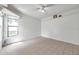 Bonus room featuring tile floors, shelving and a large window at 2048 Ground Squirrel Dr, New Port Richey, FL 34655