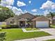 Charming single-Gathering home with a well-manicured lawn, inviting entrance, and a two-car garage, perfect for a growing Gathering at 2048 Ground Squirrel Dr, New Port Richey, FL 34655