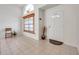 Bright foyer with tile flooring, high ceilings, and a decorative window providing natural light at 2048 Ground Squirrel Dr, New Port Richey, FL 34655