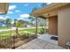 Inviting front porch with brick accents, decorative plants, and a view of the neighborhood at 2048 Ground Squirrel Dr, New Port Richey, FL 34655