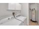 Laundry room with washer, dryer, and a water heater at 2048 Ground Squirrel Dr, New Port Richey, FL 34655