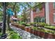 Entrance to the Library featuring brick architecture, lush landscaping, and a welcoming atmosphere in a community space at 2048 Ground Squirrel Dr, New Port Richey, FL 34655
