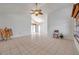Open-concept living room with tile flooring, vaulted ceiling, and a view into the dining area at 2048 Ground Squirrel Dr, New Port Richey, FL 34655