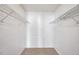 Walk-in closet equipped with wire shelving system for organized storage at 2048 Ground Squirrel Dr, New Port Richey, FL 34655
