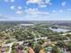 Expansive aerial view of a residential neighborhood with lakes and lush greenery at 2101 Sunset Point Rd # 201, Clearwater, FL 33765