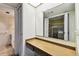 Bathroom with vanity and view to the walk-in closet at 2101 Sunset Point Rd # 201, Clearwater, FL 33765