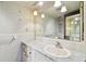 Bathroom featuring a vanity with a large mirror and ample lighting at 2101 Sunset Point Rd # 201, Clearwater, FL 33765