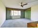 Bedroom with vintage wallpaper and carpet at 2101 Sunset Point Rd # 201, Clearwater, FL 33765