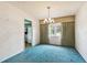 Bright dining room with a chandelier and windows that offer natural lighting at 2101 Sunset Point Rd # 201, Clearwater, FL 33765