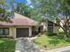 Charming single-Gathering home featuring a stone-accented garage and beautiful landscaping at 2101 Sunset Point Rd # 201, Clearwater, FL 33765