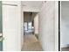 Entry hallway with decorative wallpaper leading into the living spaces at 2101 Sunset Point Rd # 201, Clearwater, FL 33765