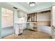 This bright kitchen with breakfast nook gives access to the living areas of the home at 2101 Sunset Point Rd # 201, Clearwater, FL 33765