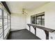 Enclosed lanai with ceiling fan, large sliding windows, and a built in bar for entertaining at 2101 Sunset Point Rd # 201, Clearwater, FL 33765
