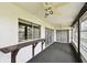 Enclosed lanai with ceiling fans, large sliding windows, and a convenient bar for entertaining at 2101 Sunset Point Rd # 201, Clearwater, FL 33765