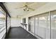 Enclosed lanai with ceiling fans, large sliding windows and a convenient built-in bar at 2101 Sunset Point Rd # 201, Clearwater, FL 33765