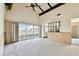 Large living room leading to the sun room at 2101 Sunset Point Rd # 201, Clearwater, FL 33765