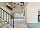 Open-concept living room with vaulted ceilings, ceiling fan, and large sunroom beyond sliding glass doors at 2101 Sunset Point Rd # 201, Clearwater, FL 33765