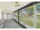 Sun room with windows and a view of the backyard at 2101 Sunset Point Rd # 201, Clearwater, FL 33765