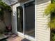 Side exterior view of home with a glass sliding door at 21045 Lazy Days Cir, Lutz, FL 33558