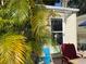 Cozy exterior patio surrounded by lush foliage at 21045 Lazy Days Cir, Lutz, FL 33558
