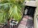 Exterior shot showing utilities and storage with lush foliage, highlighting the practical aspects and natural surroundings at 21045 Lazy Days Cir, Lutz, FL 33558