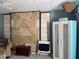 Living room accent wall in stone and black framing creates a chic and stylish architectural feature at 21045 Lazy Days Cir, Lutz, FL 33558