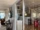 Open-concept living area with glass doors, neutral tones, and access to other rooms, creating a cohesive living space at 21045 Lazy Days Cir, Lutz, FL 33558