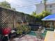 Outdoor patio with a hot tub, grill, and patio seating at 21045 Lazy Days Cir, Lutz, FL 33558
