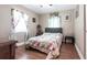 Bright bedroom with floral accents, wood floors, and natural light at 22348 Olean Blvd, Port Charlotte, FL 33952