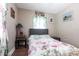 Well-lit bedroom with floral accents, wood floors, and soft lighting at 22348 Olean Blvd, Port Charlotte, FL 33952
