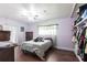 Cozy bedroom with wood floors, ample closet space, and a comfortable bed at 22348 Olean Blvd, Port Charlotte, FL 33952