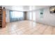 Bright bonus room with tile floors, double doors to the backyard, and neutral décor at 22348 Olean Blvd, Port Charlotte, FL 33952