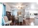 Bright dining room with wood floors, stylish furnishings, and adjacent modern kitchen at 22348 Olean Blvd, Port Charlotte, FL 33952