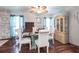 Inviting dining room featuring a glass table, wood floors, and elegant decor at 22348 Olean Blvd, Port Charlotte, FL 33952