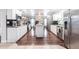 Modern kitchen featuring white cabinets, stainless steel appliances, and an island with granite countertops at 22348 Olean Blvd, Port Charlotte, FL 33952