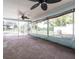 Spacious screened lanai with tiled flooring and a view of the pool and backyard at 22348 Olean Blvd, Port Charlotte, FL 33952