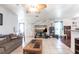 Comfortable living area with tile floors and an accent stone wall with mounted television at 22348 Olean Blvd, Port Charlotte, FL 33952