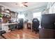 Bright office space with light blue walls, a ceiling fan, two desks, and multiple storage shelves at 22348 Olean Blvd, Port Charlotte, FL 33952