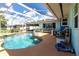 Refreshing pool featuring a screened enclosure, deck, and access to an outdoor seating area at 22348 Olean Blvd, Port Charlotte, FL 33952