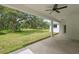 Enjoy outdoor living on this covered porch overlooking a lush green yard at 2288 Rackley Rd, Brooksville, FL 34604
