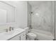 Modern bathroom with a tub, shower, and a white marble-tiled wall that exudes luxury at 2288 Rackley Rd, Brooksville, FL 34604