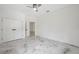 Bedroom featuring marble floors, neutral walls, walk-in closet, and ample space, offers a serene living space at 2288 Rackley Rd, Brooksville, FL 34604