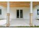 Covered porch featuring a wood ceiling and white support columns at 2288 Rackley Rd, Brooksville, FL 34604