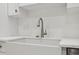 Close-up of white farmhouse sink and stainless steel faucet at 2288 Rackley Rd, Brooksville, FL 34604