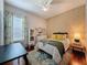 Comfortable bedroom featuring a patterned rug, natural light, and a soothing ambiance at 2326 Mountain Ash Way, New Port Richey, FL 34655